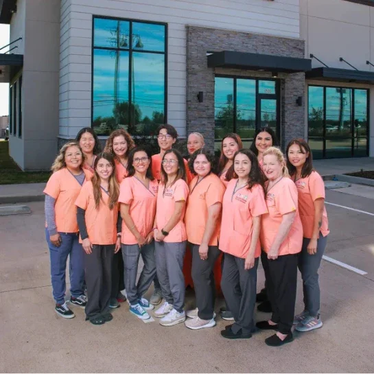 A group of happy local children playing safely outside, representing the mission behind our rewarding pediatric dental jobs